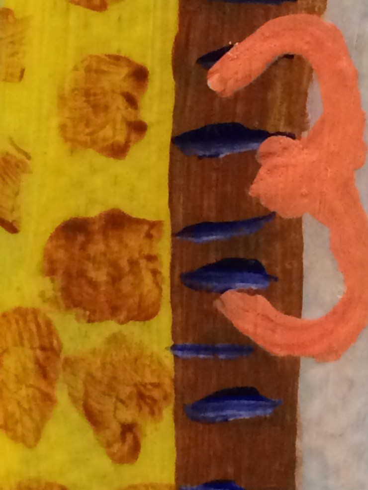 a close up of a painted orange three with yellow brown and blue painted background