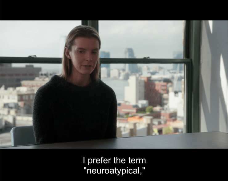 Fiona sits rigidly at a conference table with her hands folded in her lap. A view of New York is visible through the window behind her. A subtitle reads: "I prefer the term "neuro-a-typical" (Elementary. 2016a).