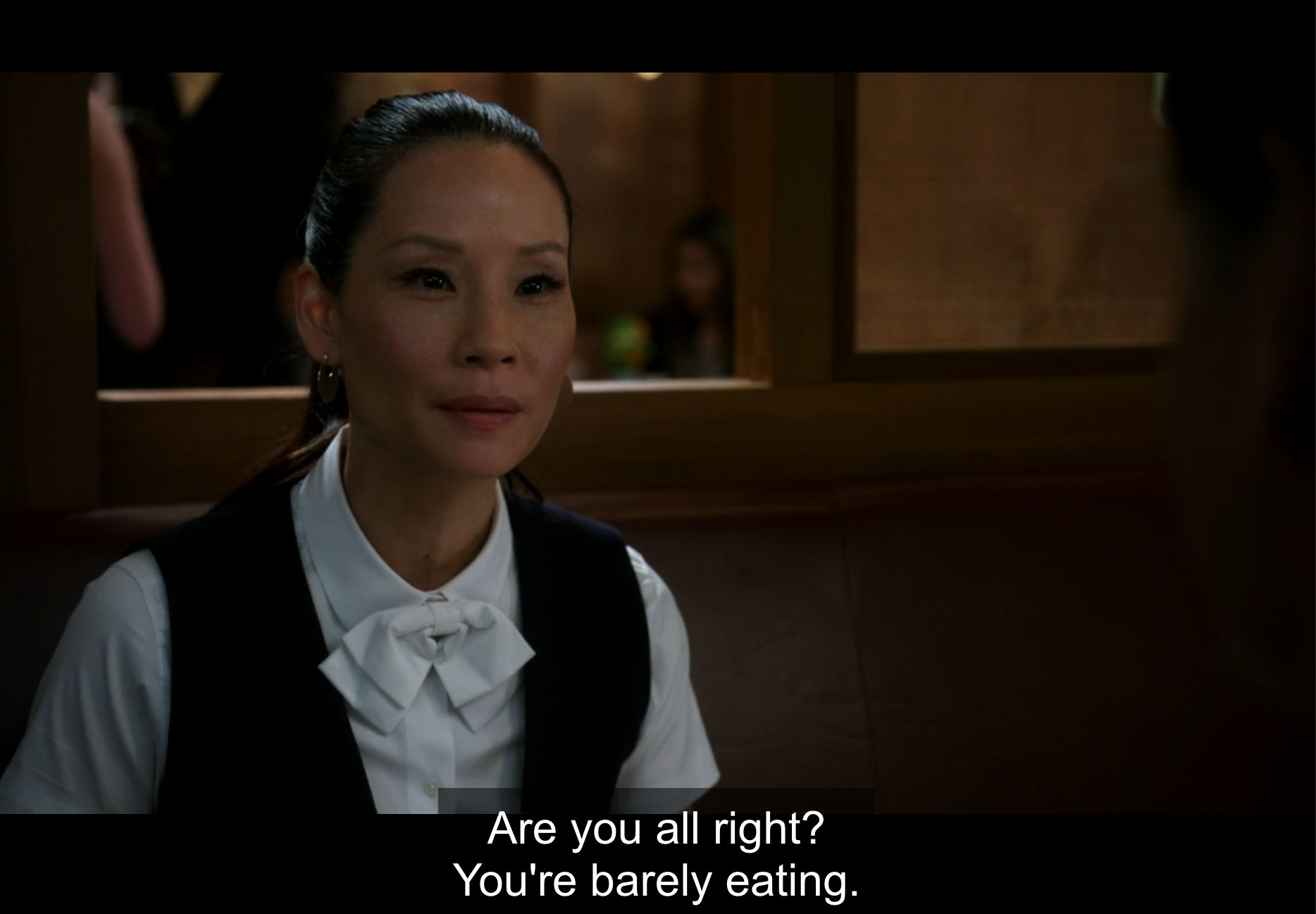 Watson expressing concern for Morland Holmes. A subtitle reads: "Are you all right? You're barely eating (Elementary. 2016a).